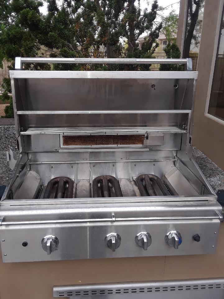 Before and after of a Viking BBQ grill that was just cleaned.